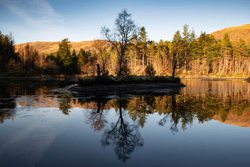 glencoe lochan, glencoe, highlands, scotland, uk. reflections in water.