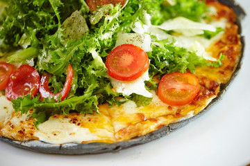 Black dough salad pizza with black pepper 