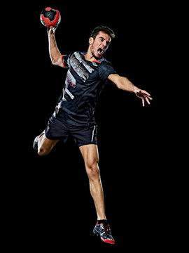 one caucasian young handball player man in studio isolated on black background