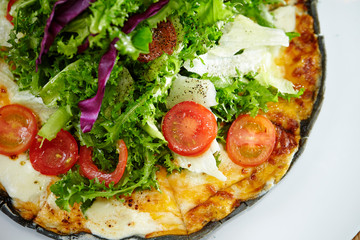Black dough salad pizza with black pepper 