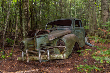 abandoned old car in forest