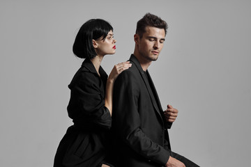 man and woman in suit and tie