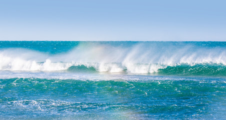 A swell wave approaches the shore