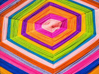Abstract vibrant and vivid colorful spiral octagon yarn pattern. Burst, handcraft, art, creativity...