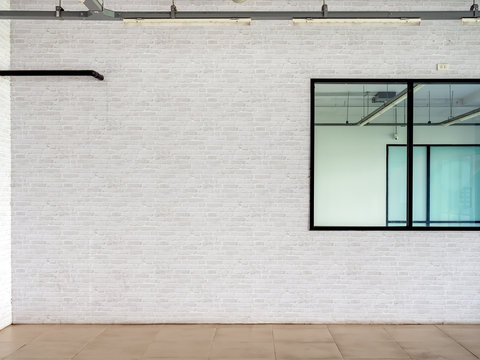 White Brick Wall Background Near The Glass Window In Empty Room.