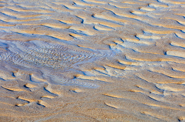 Sand dune in the water and sea beach background