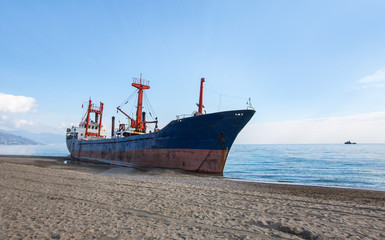 Cargo ship aground on Anamur shore waiting for rescue
