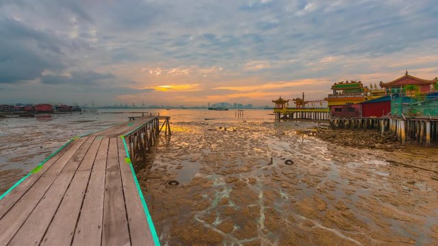 Beautiful view of  Yeoh jetty and Hean Boo Thean Kuan Yin Temple at sunrise. Penang,  Malaysia. Timelapse