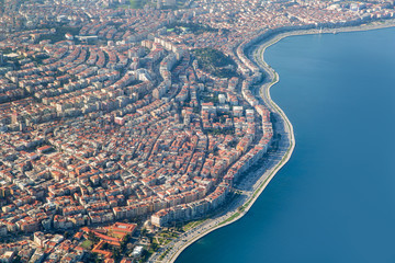 Fototapeta premium Passenger airplane flying over Izmir City