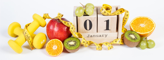 Cube calendar, fruits, dumbbells and tape measure, new years resolutions