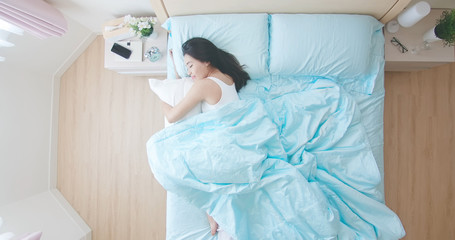 woman sleeping well in bed