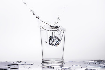 Water splashes in glass, isolated on a white background