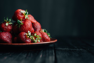 Horizontal photo of strawberries on a black background - Powered by Adobe