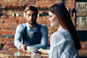 couple in cafe with cup of coffee