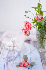 marshmallows in a glass stand and red marmalade
