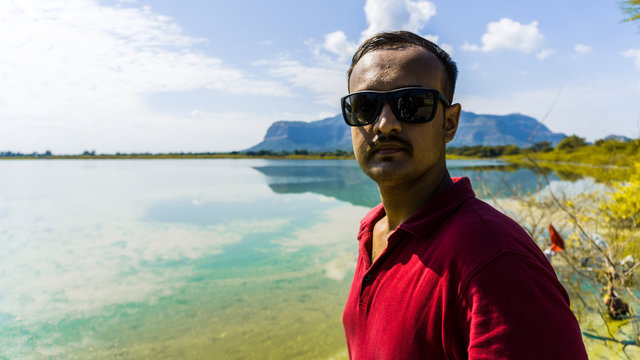 Young adult man at Vadatalav Lake also known as Pavagadh lake