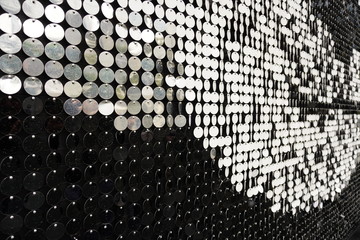 The black and white round metal plate forming a beautiful pattern at the side of the street. © peacefoo