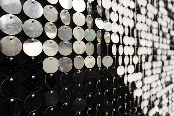 The black and white round metal plate forming a beautiful pattern at the side of the street.