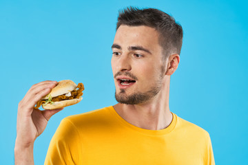 young man with hamburger