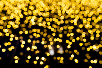 yellow bright bokeh dropping use as Christmas celebrate festival background 