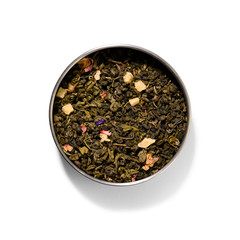 Green tea with aromatic additives. Top view on white background