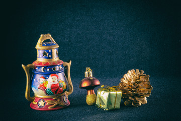 Pine cone, garland and other Christmas decoration, on a blue background