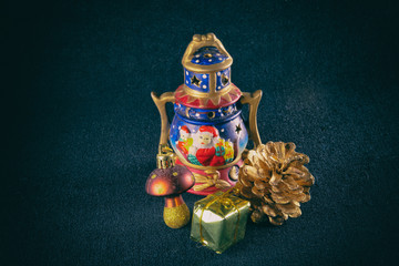 Pine cone, garland and other Christmas decoration, on a blue background