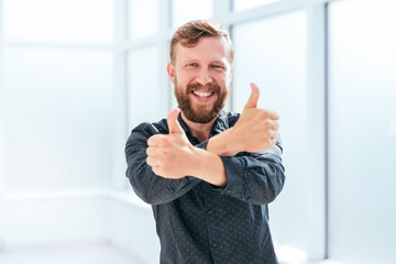 happy businessman showing thumbs up. photo with copy space