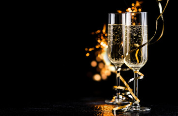 champagne glasses with sparkles