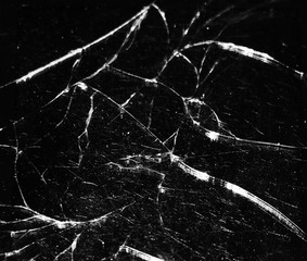 Broken glass on a black background as a texture.