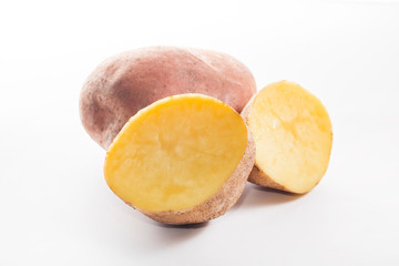 potato. whole and sliced on a white background