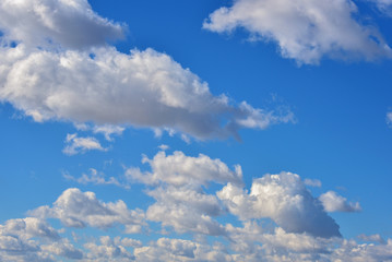 Clouds on a clear Sunny spring sky as a background