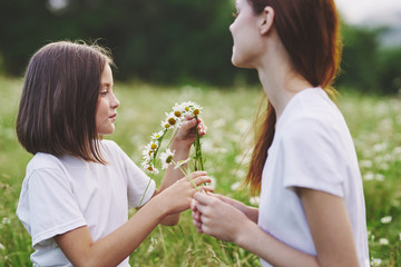 mother and daughter having fun in park