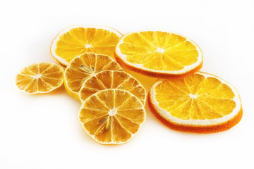 Fototapeta na wymiar A few slices of oranges and lemons on a white background
