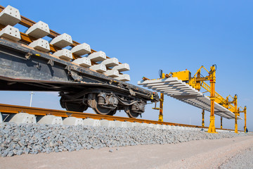 Metro (train) construction site, railroad track installation machine is in use