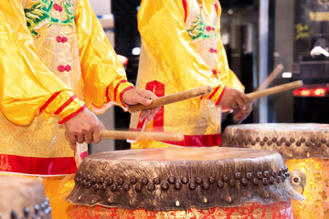 Chinese lion dance drummer beating drum in the show