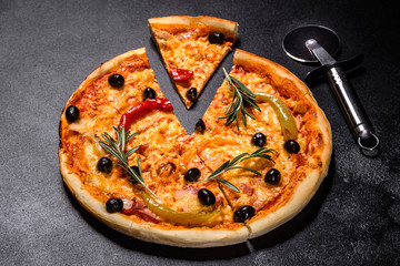 Tasty fresh hot pizza against a dark background. Pizza, food, vegetable, mushrooms