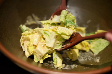 Chef mix cabbage with handmade salad dressing