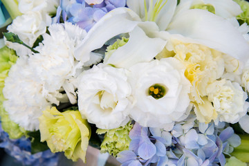 The harmony of white and blue flowers in flower basket
