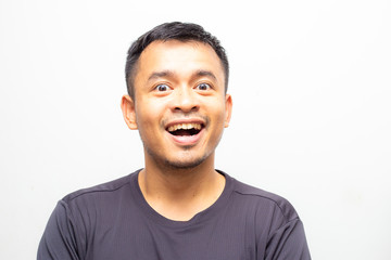 Portrait of amazing facial expression asian men face on white background