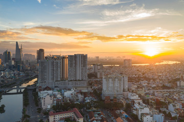 Naklejka na ściany i meble Aerial view of Ho Chi Minh city under sunset sky