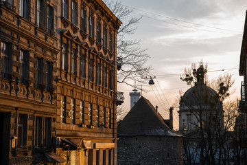 Fototapeta premium view of urban city street on sunset