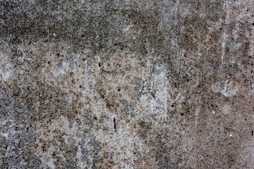 Texture of a concrete wall with cracks and scratches which can be used as a background