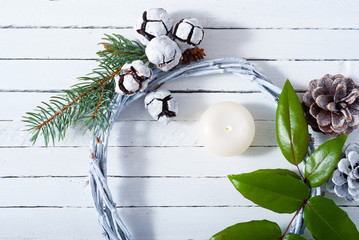 Christmas wreath on white wood table