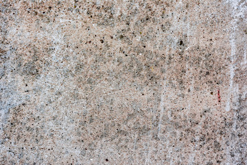 Texture of a concrete wall with cracks and scratches which can be used as a background