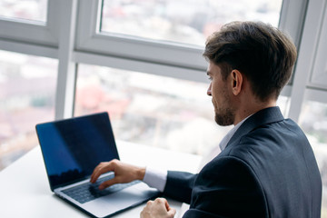 businessman working on laptop in the city