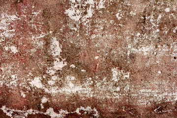 Texture of a concrete wall with cracks and scratches which can be used as a background