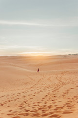 Fototapeta na wymiar Girl standing in desert.