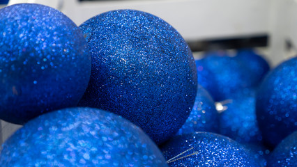 New Year`s blue balls lie in a box