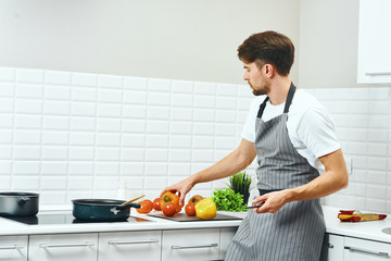 woman cutting vegetables in the kitchen